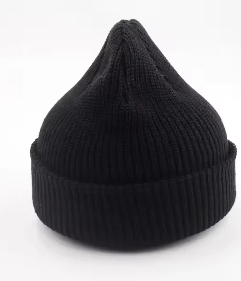 Black rib-knit beanie with a folded cuff on a white background