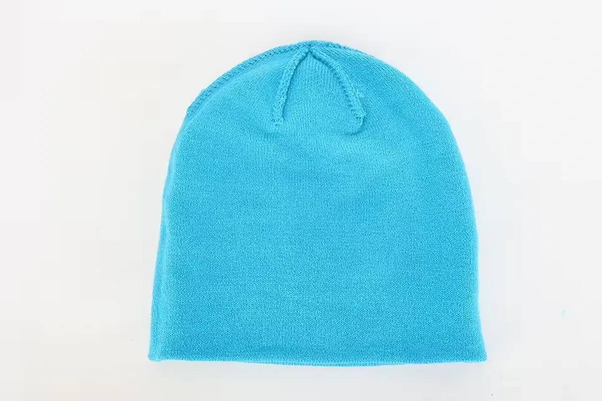 Blue knit beanie with a folded cuff.