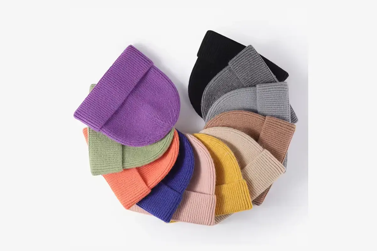 Cuffed knit beanies in a range of sample colors.