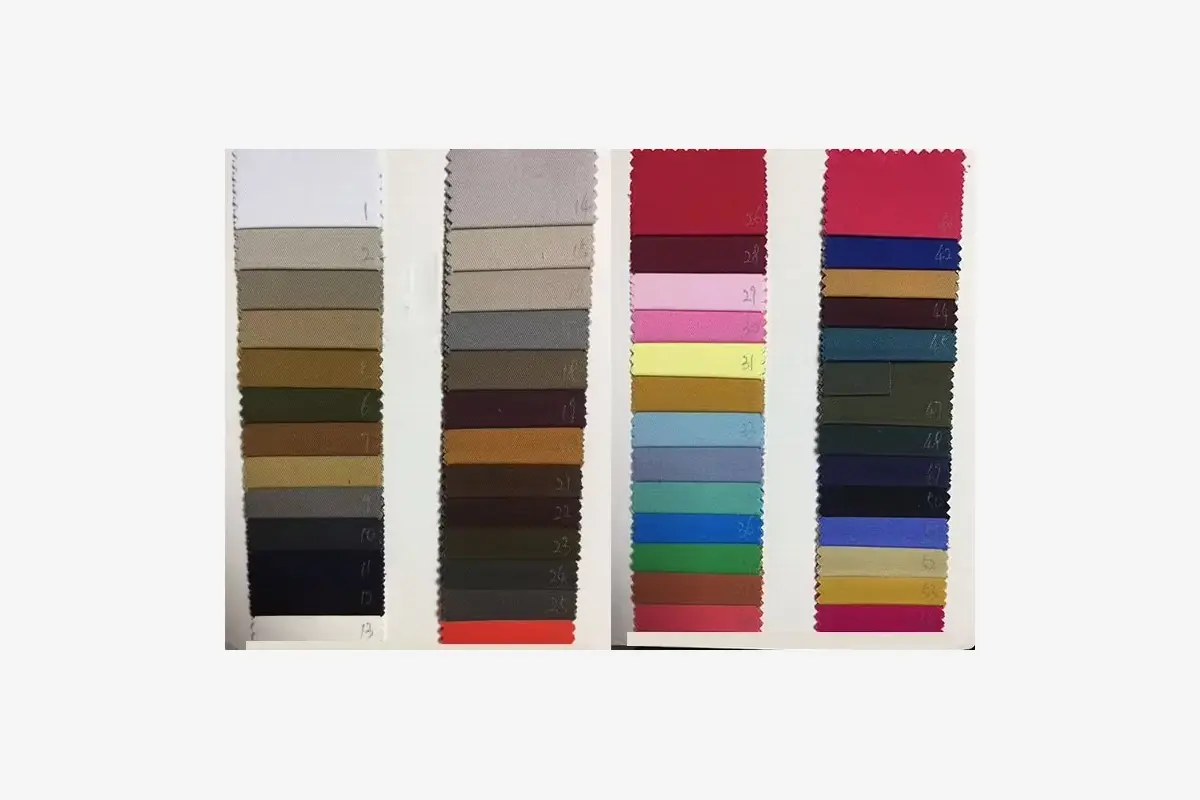 Physical fabric color swatches arranged by shade.