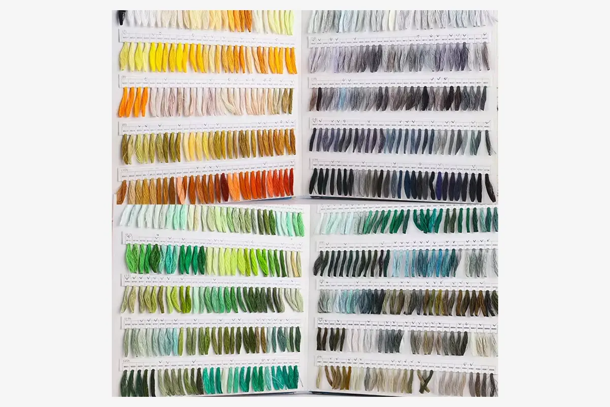 Yarn shade cards with labeled color samples.