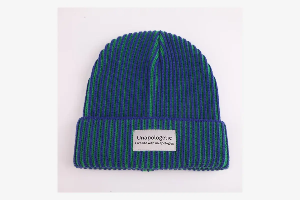 Blue and green rib-knit beanie with a woven front label.