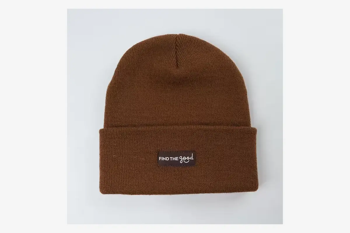 Brown cuffed beanie with a dark rectangular front patch.