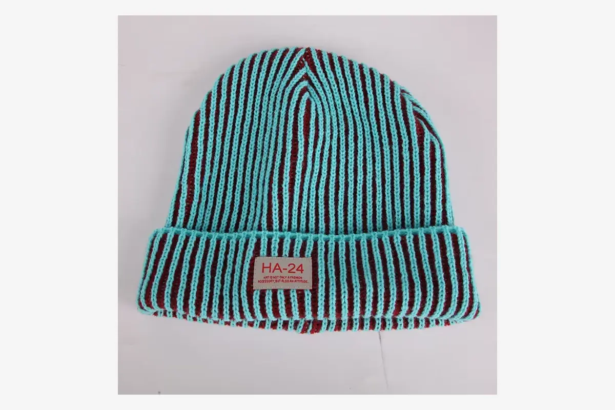 Striped cuffed beanie with a small rectangular patch centered on the cuff.