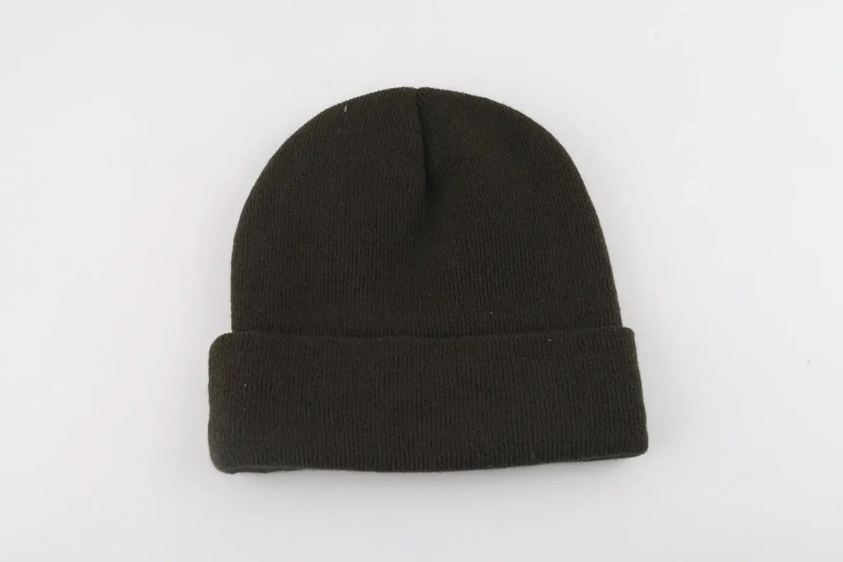 Black rib-knit cuffed beanie photographed on a light background