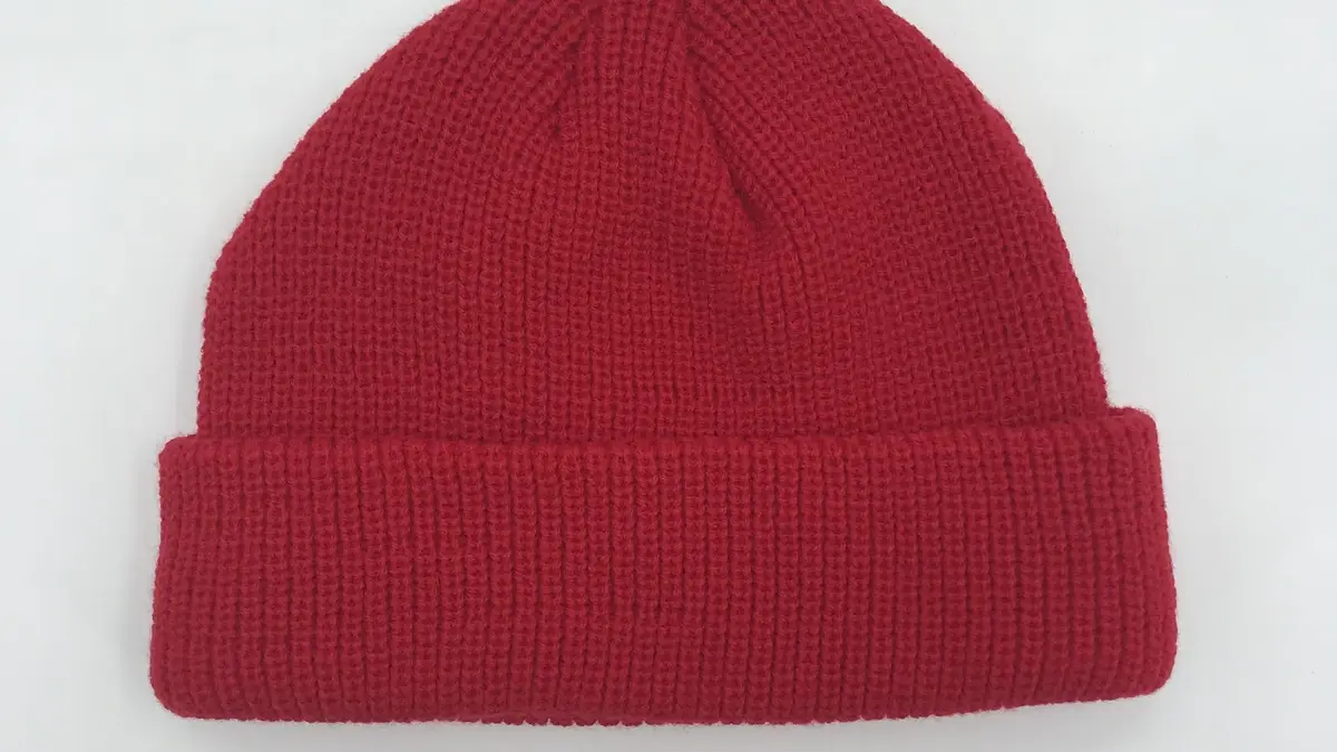 Red rib-knit beanie with a folded cuff.