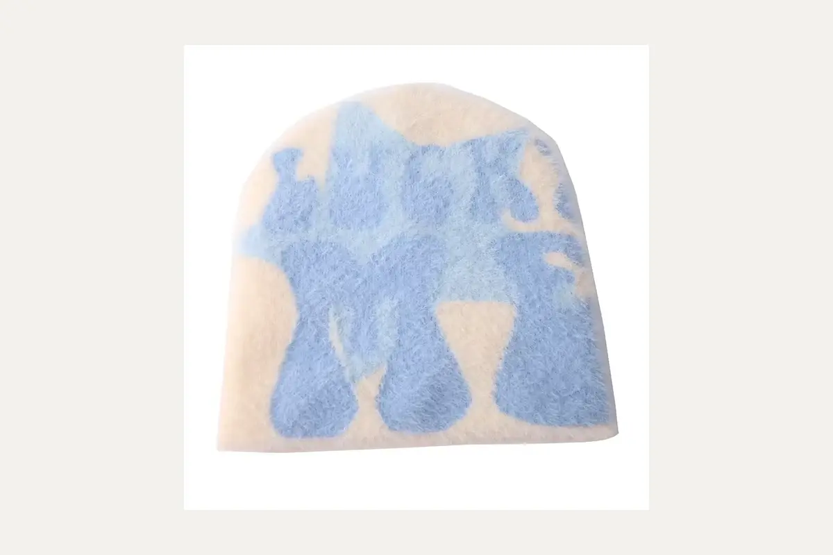 Blue and cream patterned knit beanie.