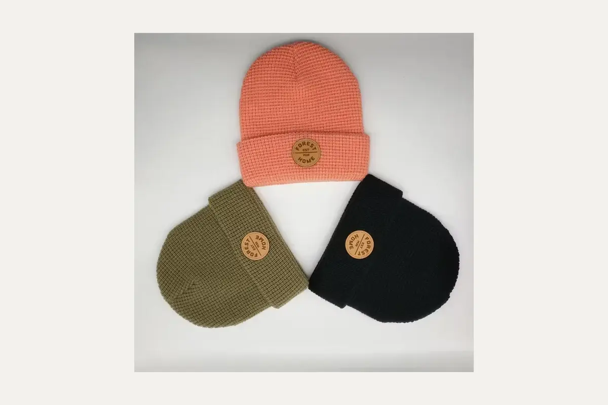 Cuffed beanies showing several sewn patch styles.