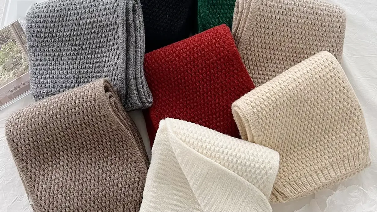A group of rib-knit beanies in assorted colors.