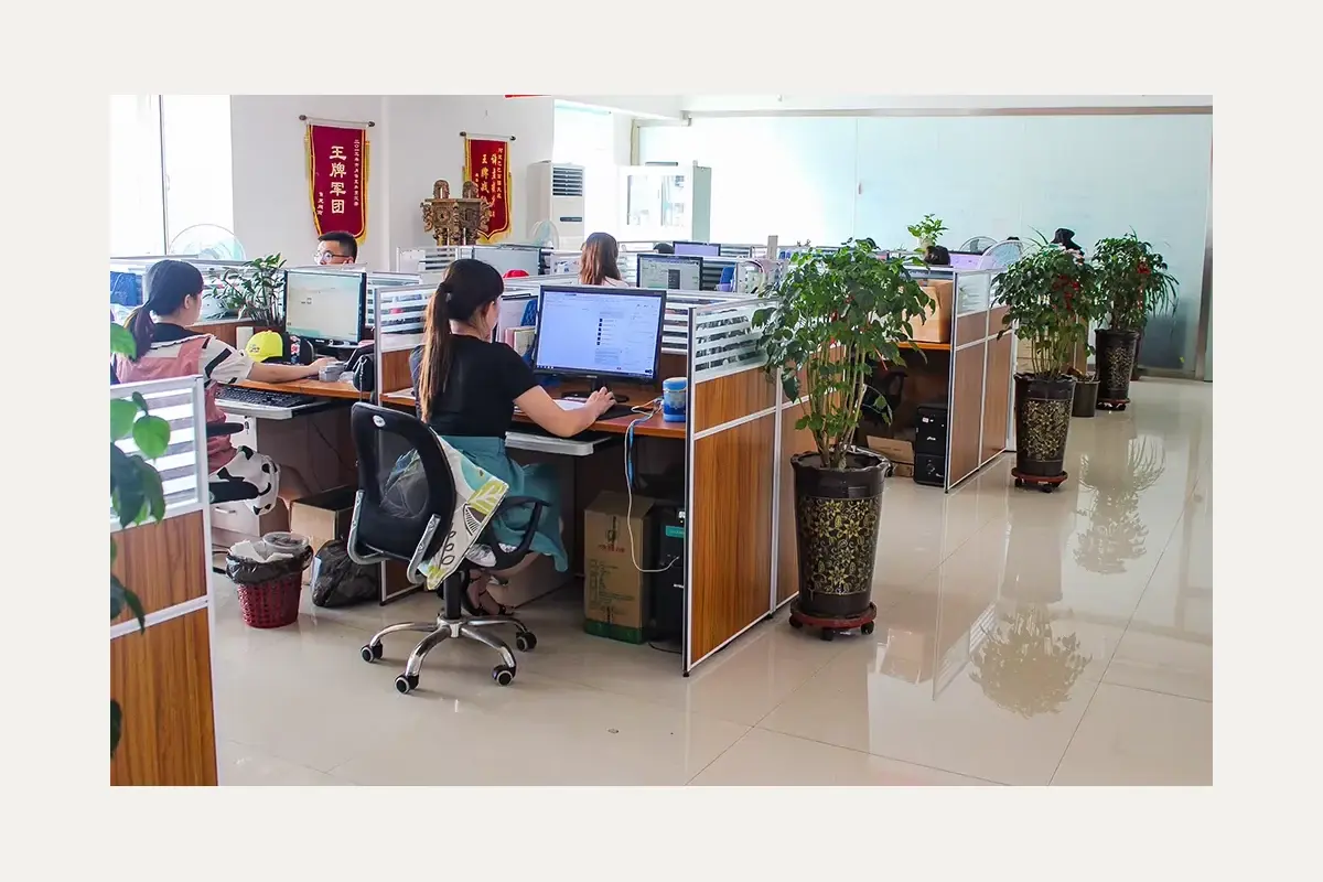 Staff working at computers in a production office.