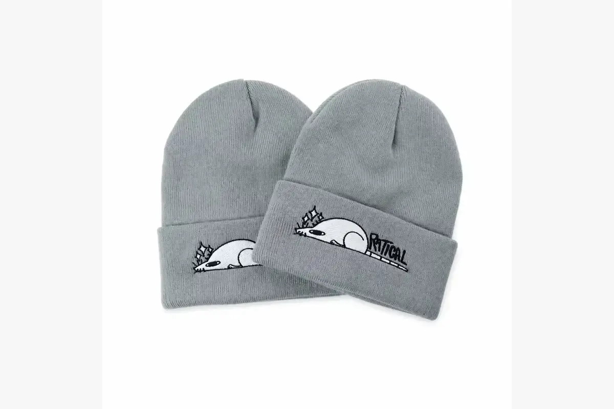 Two gray cuffed beanies showing different views of an embroidered front logo