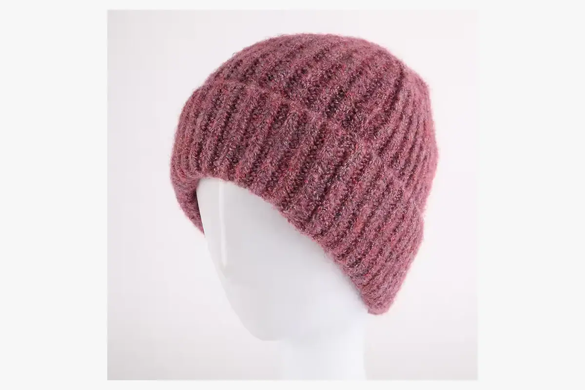Burgundy textured knit beanie shown on a display head