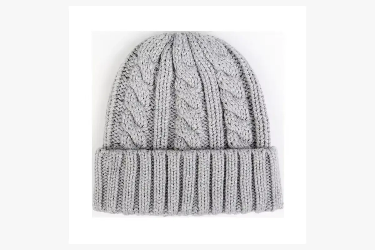 Gray cable-knit beanie with a folded ribbed cuff