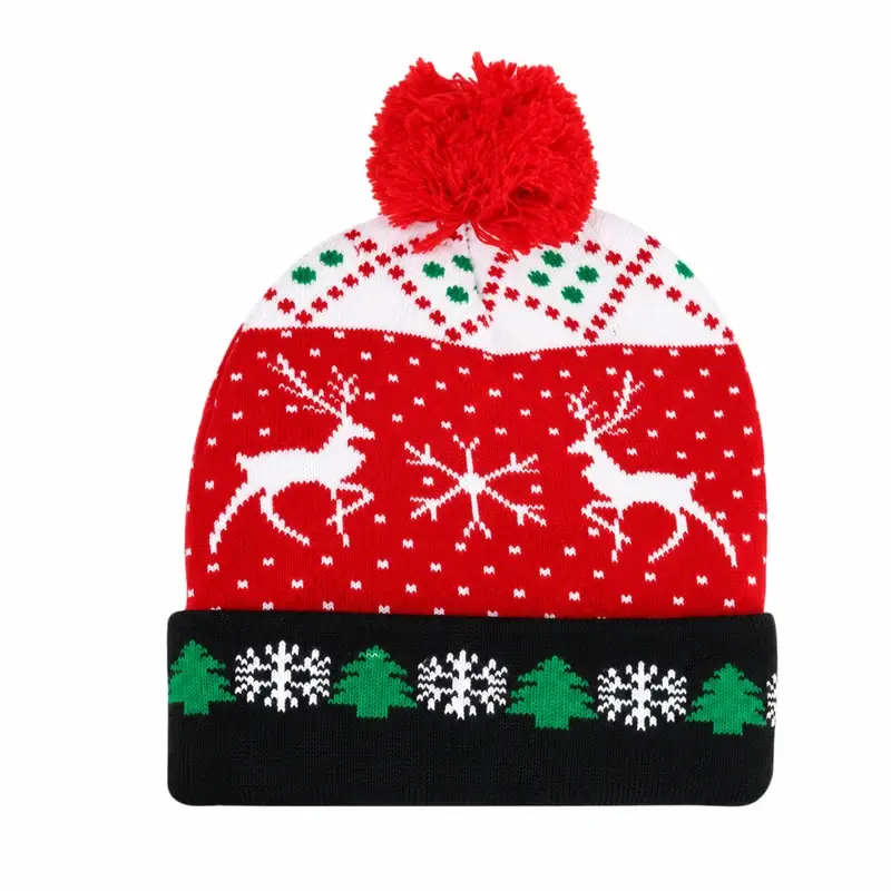 Red Christmas beanie with repeating snowflake bands, green details and a pom-pom