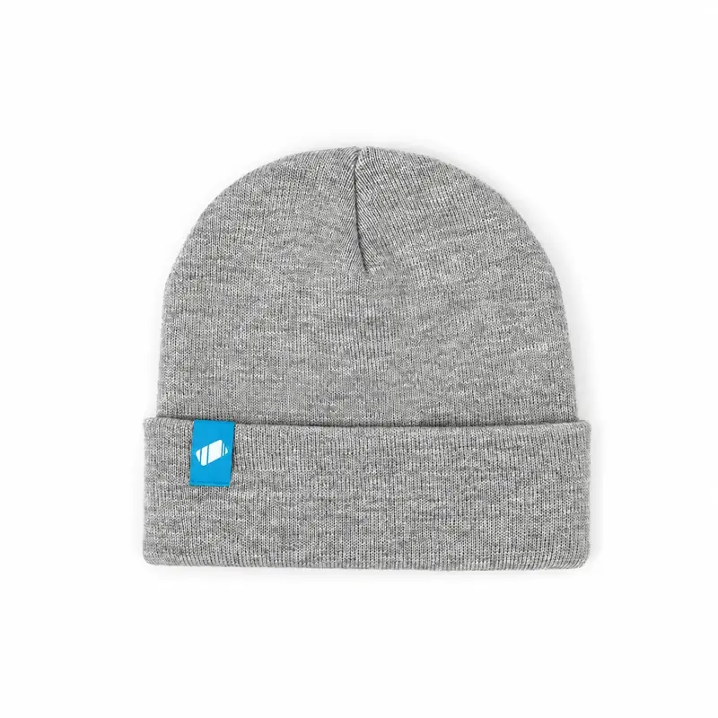 Light gray cuffed knit beanie with fine heathered stitches and blue patch