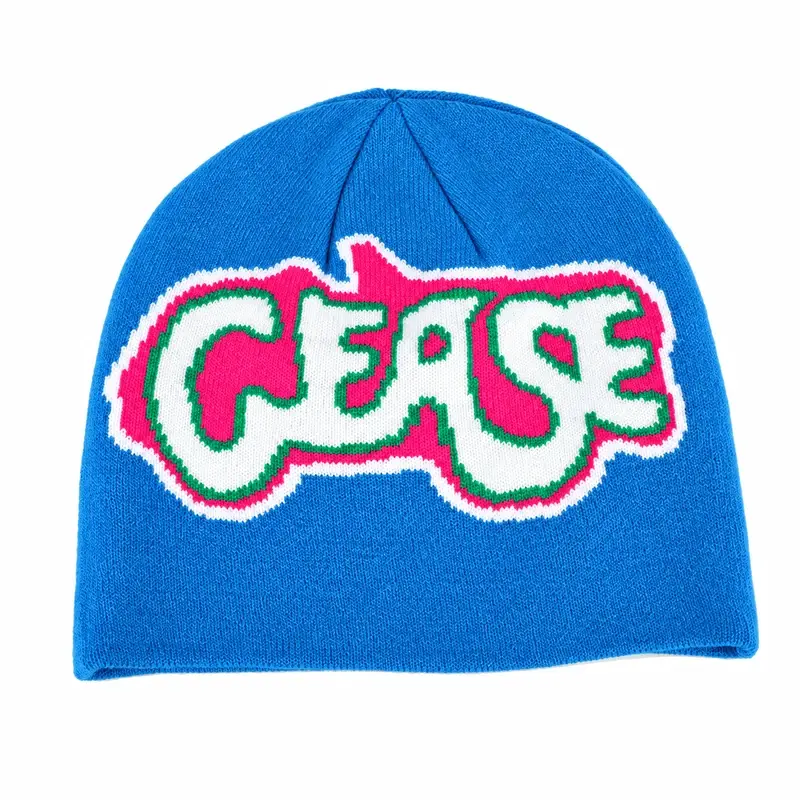 Single blue lightweight cuffless knit beanie with pink and green letter graphic