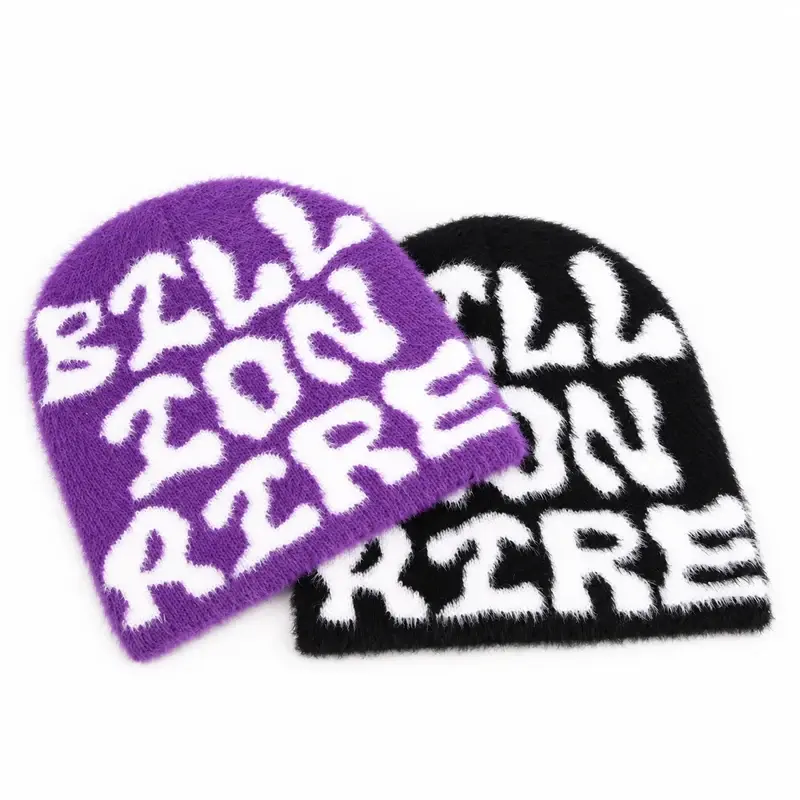 Two cuffless beanies in purple and black with all-over knitted white lettering