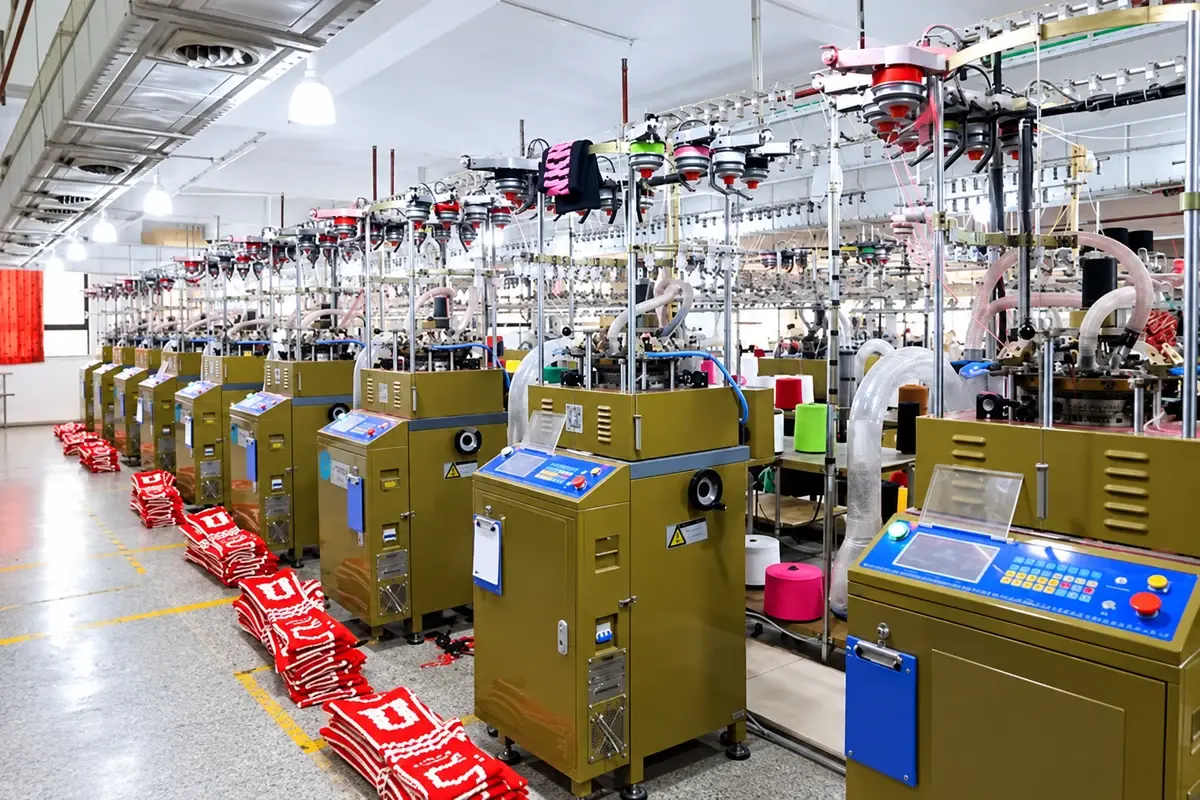 Knitting equipment and production machinery on a factory floor