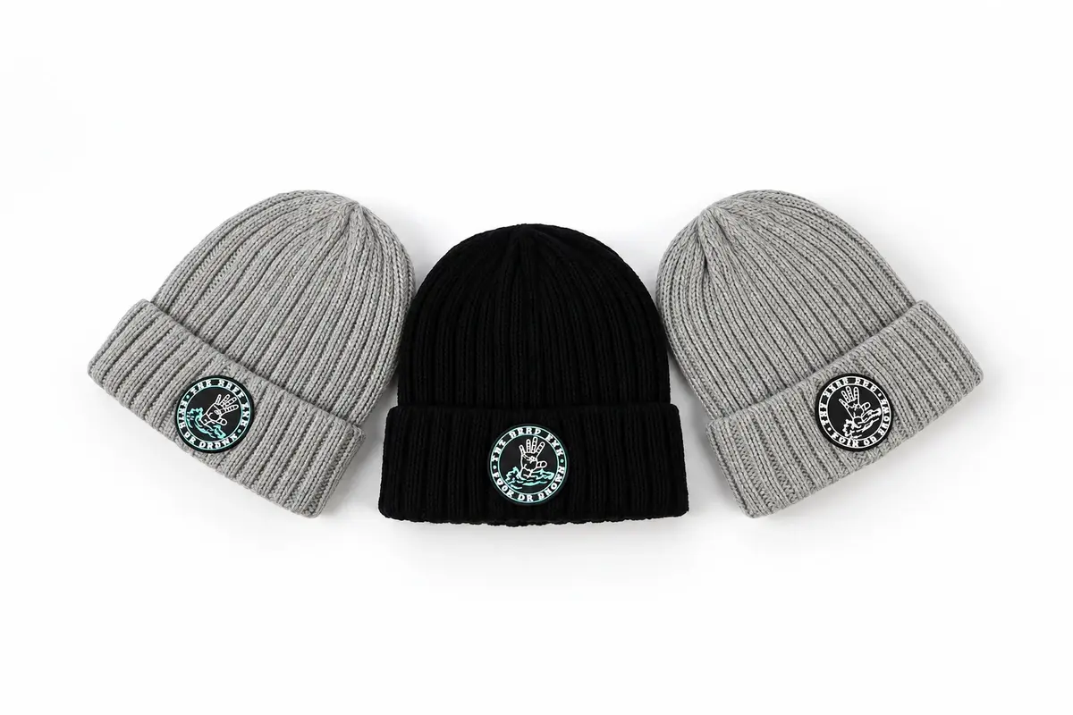 Three short fisherman beanies showing cuff height and compact wearing profile