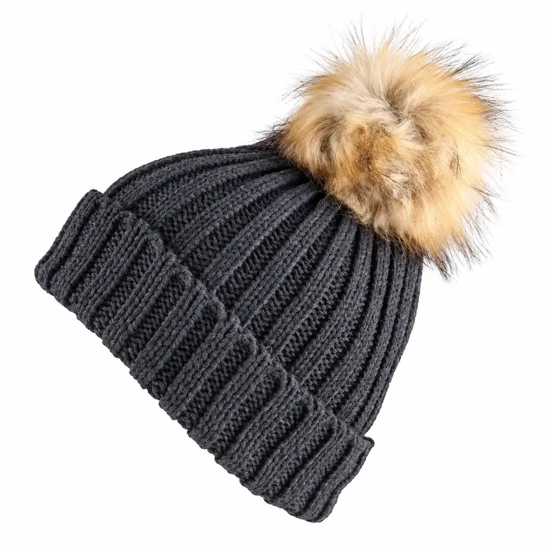 Dark gray cable-knit cuffed beanie with a large light faux fur pom