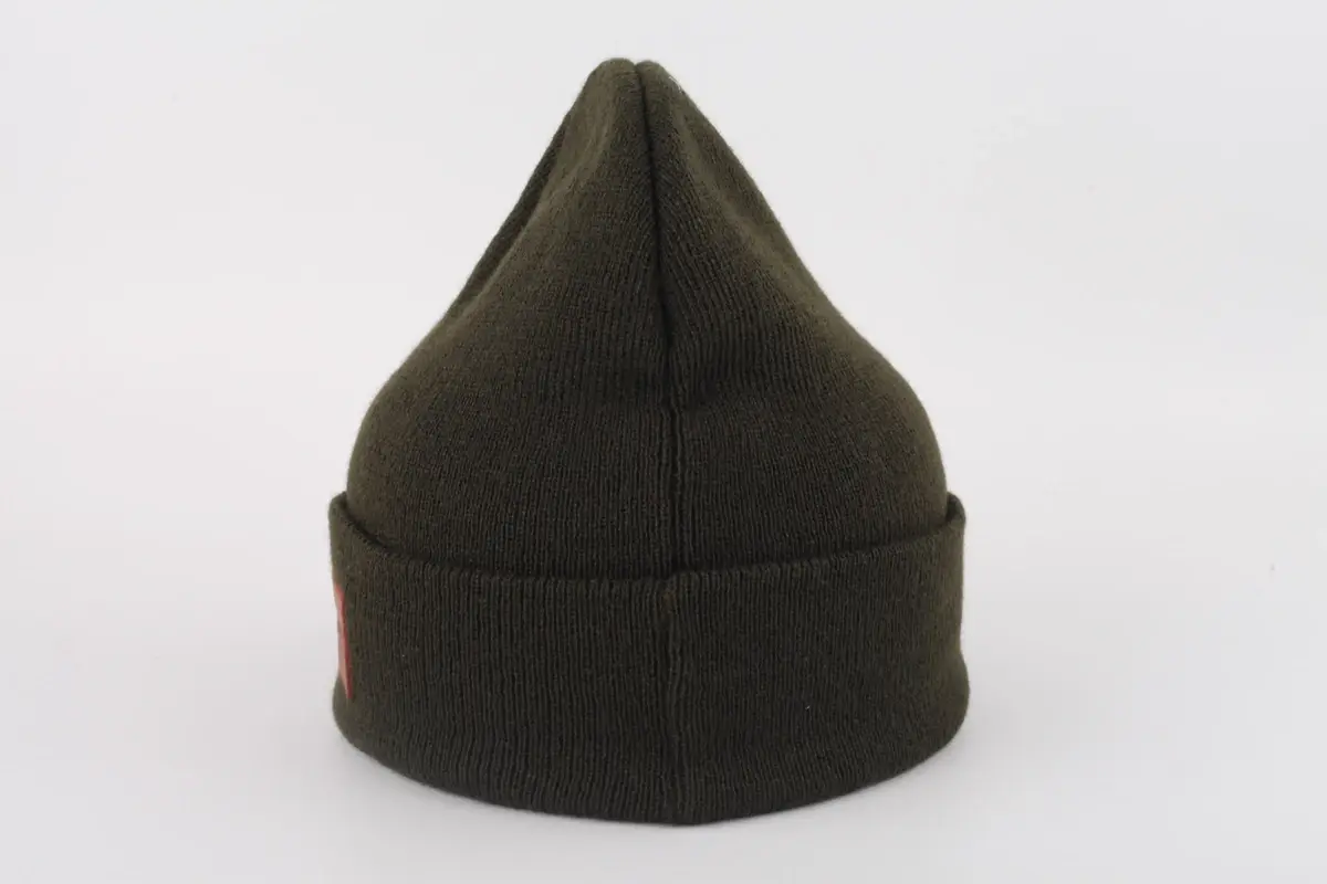 Black cuffed rib-knit beanie shown from the side