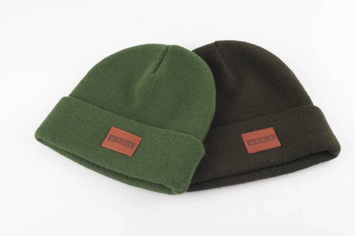 Green and black rib-knit beanies with sewn front patches