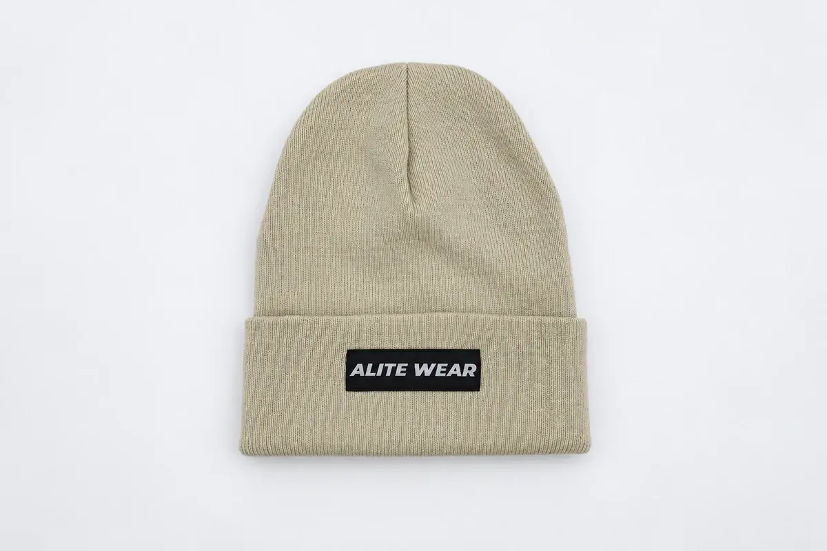 Beige rib-knit cuffed beanie with front woven label