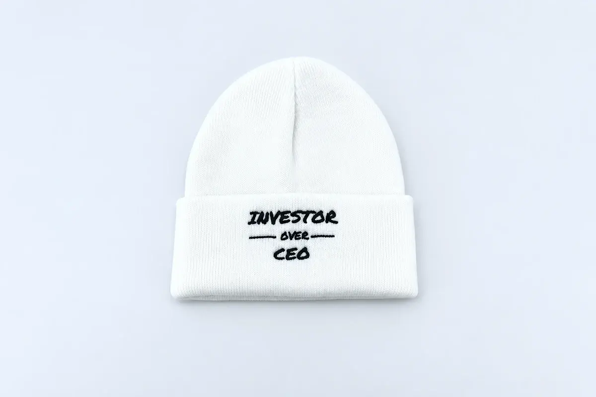 White rib-knit cuffed beanie with woven front label