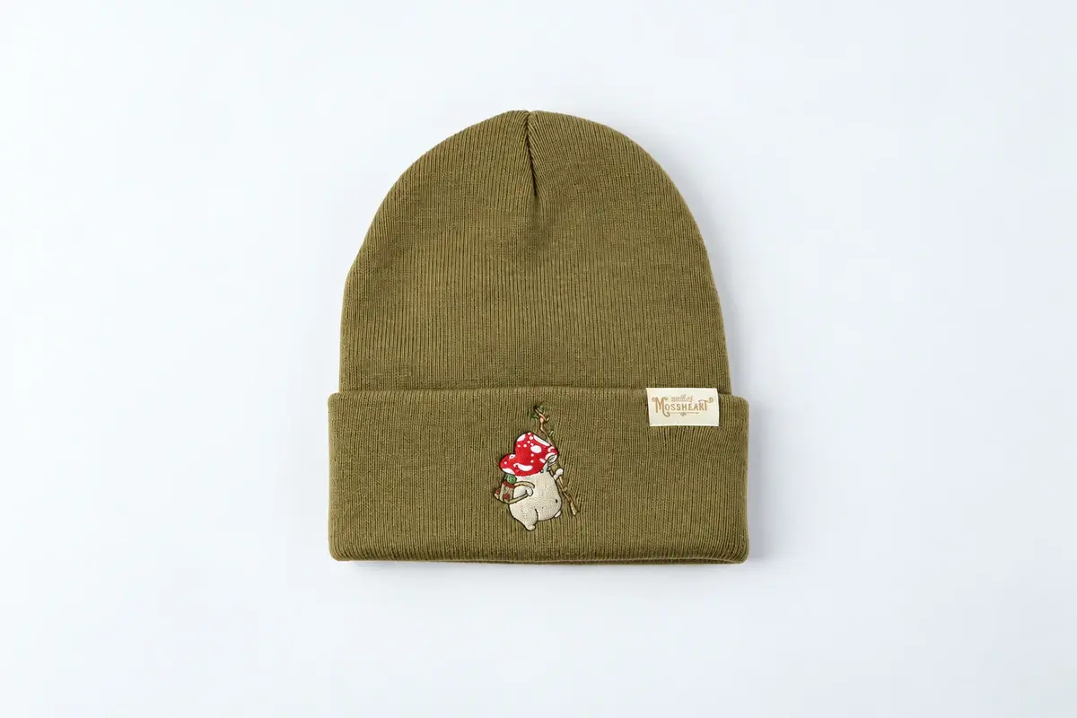 Olive green rib-knit cuffed beanie with small patch