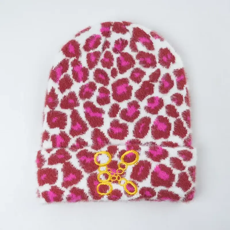 Pink patterned cuffed beanie shown from the front
