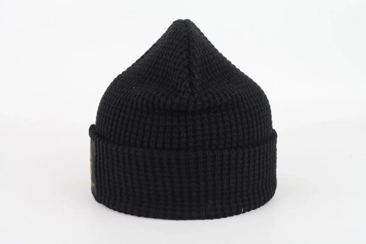 Black rib-knit beanie with a folded cuff