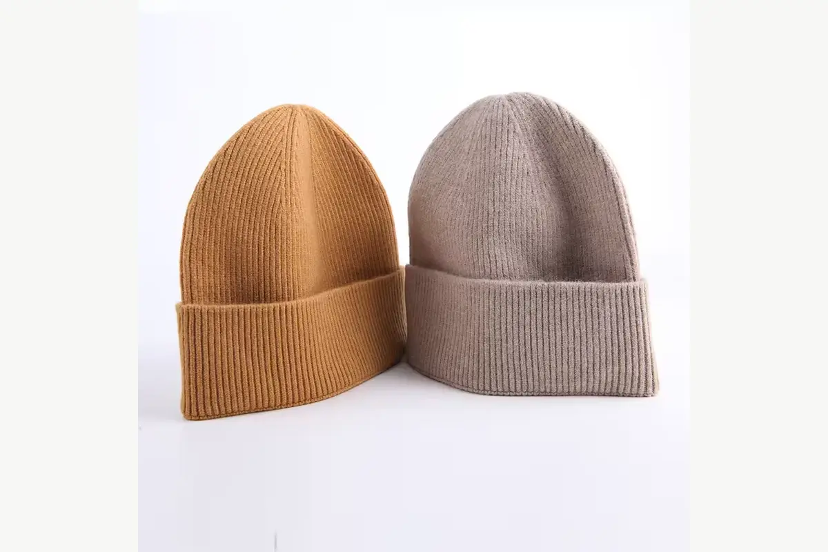 Camel and taupe cuffed beanies shown together