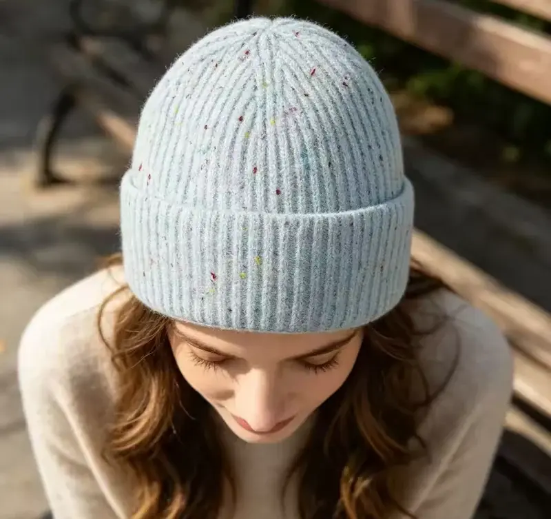 Ribbed cuffed beanie worn to show crown depth and fit