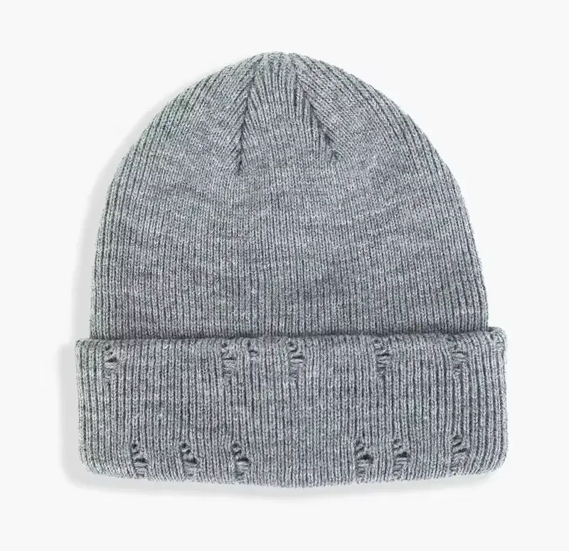 Gray knit beanie with a folded cuff and distressed stitch details