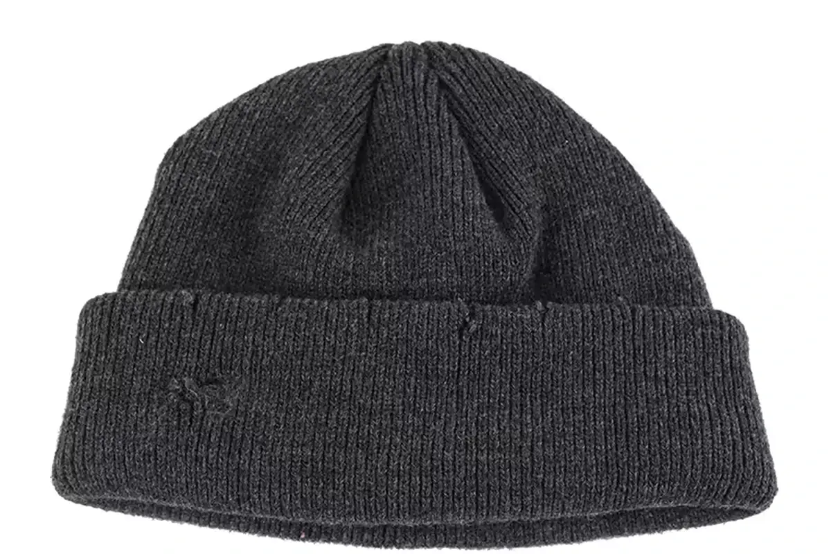 Black short knit fisherman beanie with a folded cuff and shaped crown