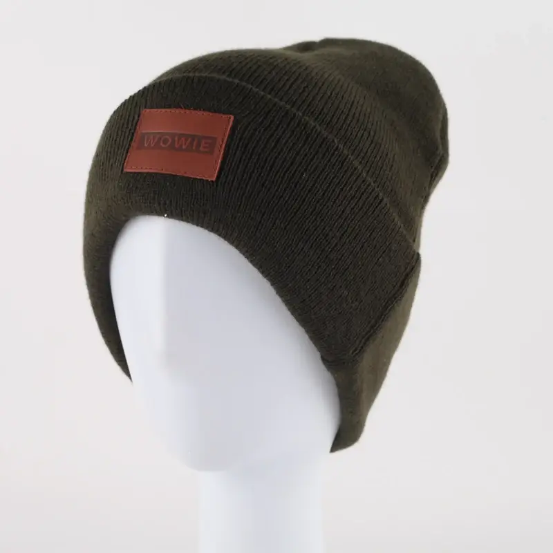 Dark olive knit beanie with a brown front patch