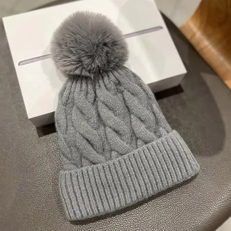 Cable-knit pom-pom beanie with folded rib cuff