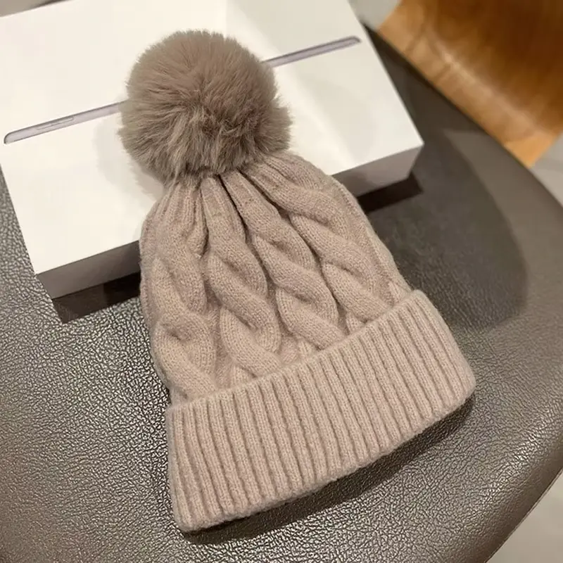 Cable-knit pom-pom beanie with folded rib cuff