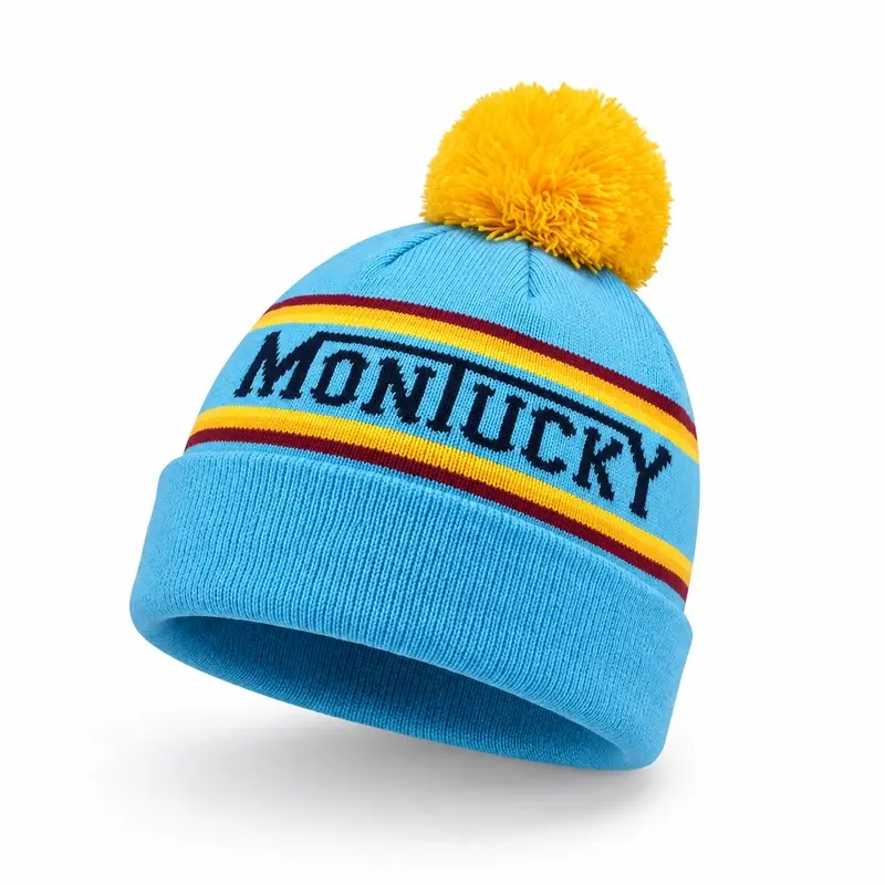 Blue jacquard beanie with yellow pom pom