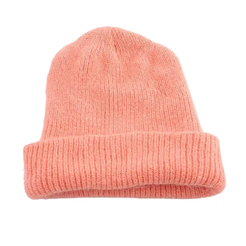 Peach knit beanie showing its crown height and folded opening