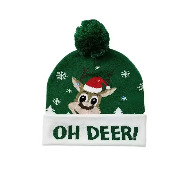 Green Christmas beanie with reindeer motif and dark green pom pom