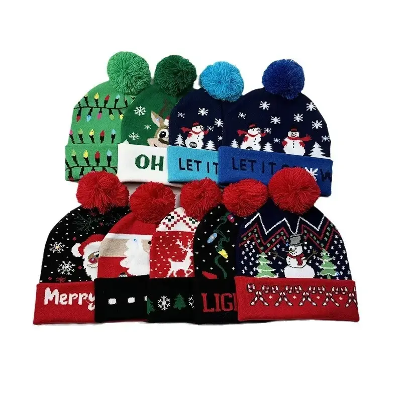 Assortment of colorful Christmas beanies with seasonal motifs and pom poms