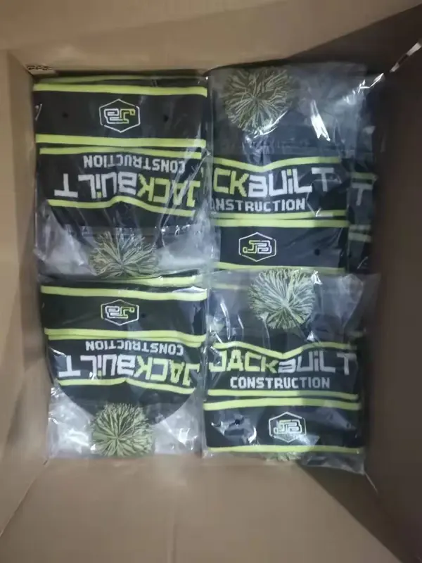 Branded knit hats packed individually in clear bags inside a carton