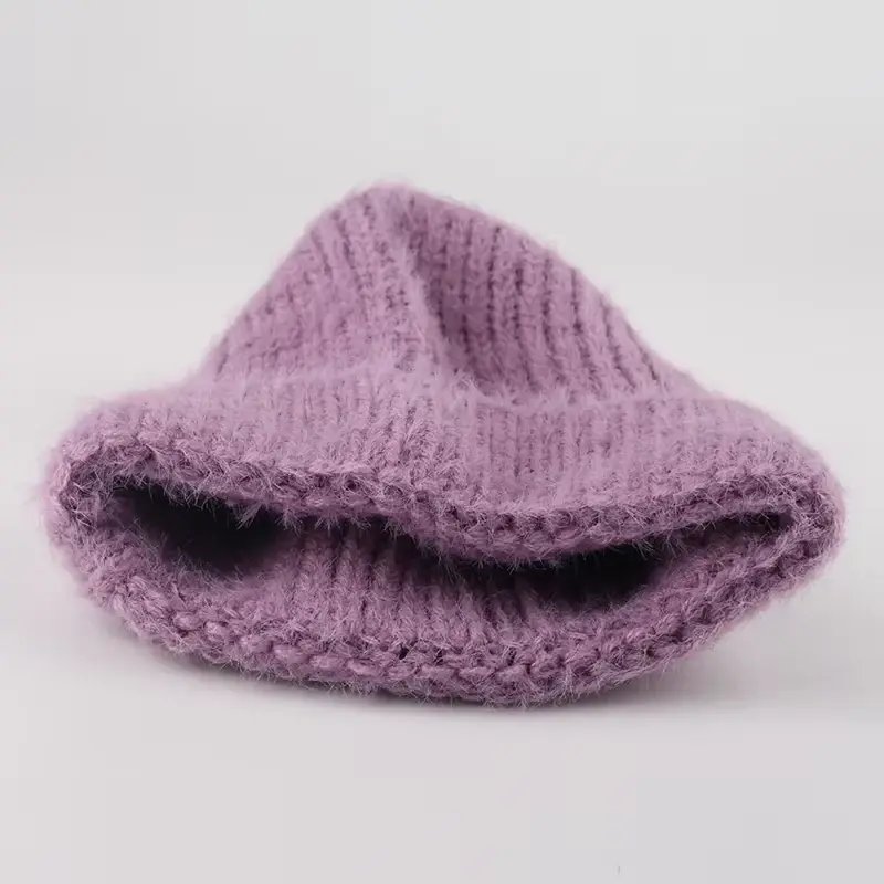 Lavender chunky knit beanie showing the folded cuff and interior