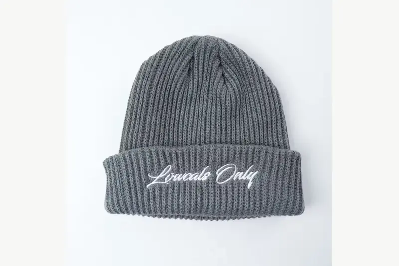 Gray cuffed knit beanie with white embroidered lettering
