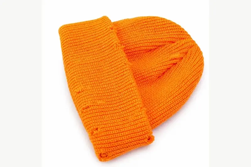 Orange chunky knit beanie with a folded cuff