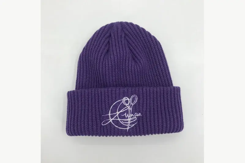 Purple cuffed knit beanie with an embroidered front logo