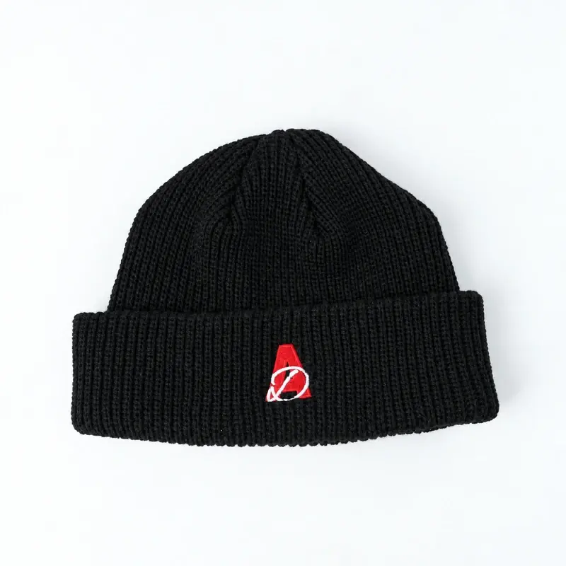 Black short cuffed beanie with red embroidered logo