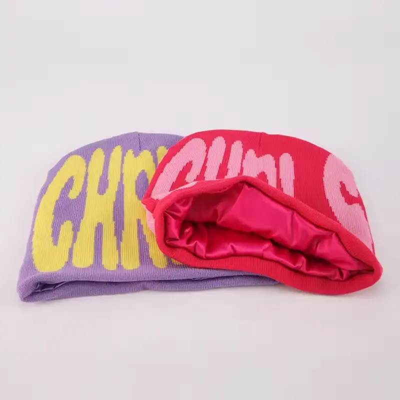 Pink and lavender cuffless beanie folded to show the inner knit layer