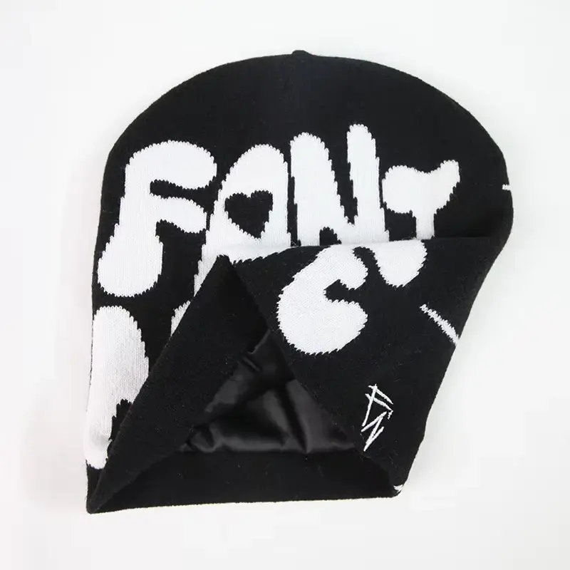 Black cuffless beanie folded open to show the inner layer